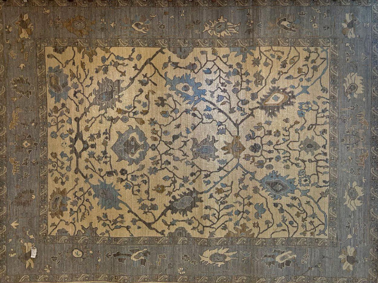 Muted transitional handmade rug
